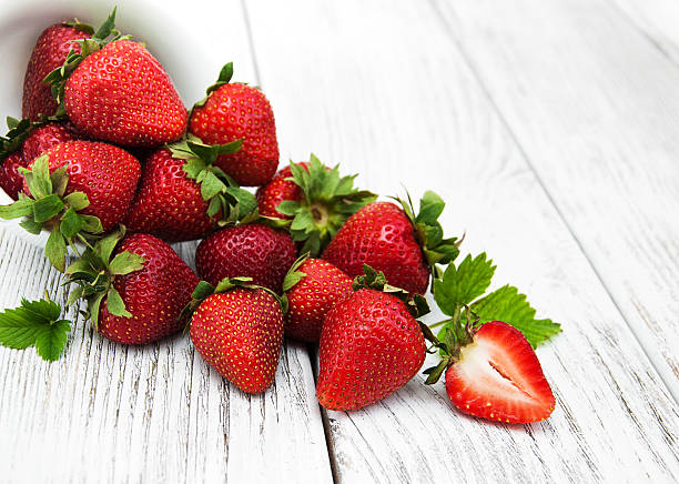 istock ripe strawberries on wooden table 636641186