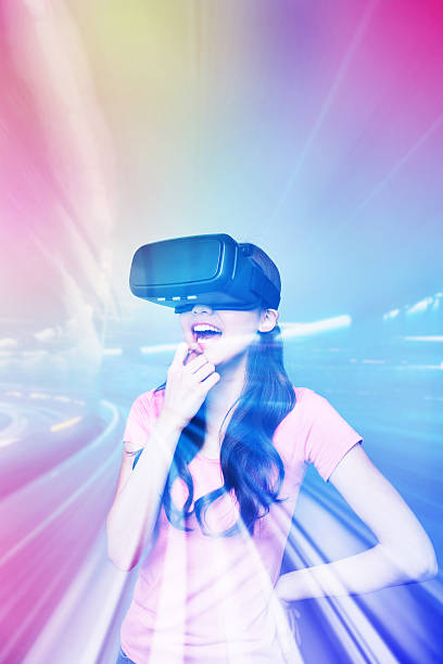 istock Happy woman watching virtual reality 636642846