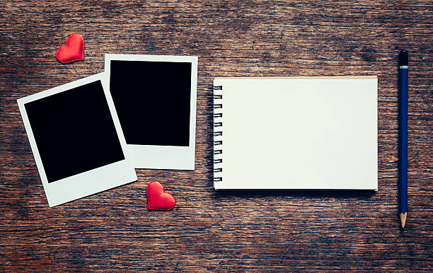 istock Blank photo frame, notebook, pencil and red heart for valentine 636643716