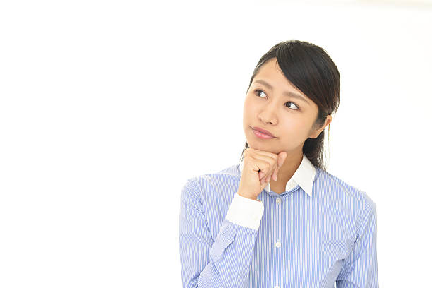istock Uneasy Asian business woman 636644496