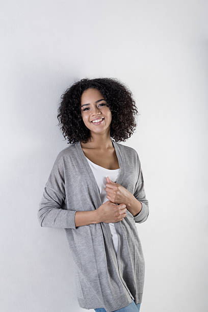 istock Young trendy woman leaning against a wall 636649396