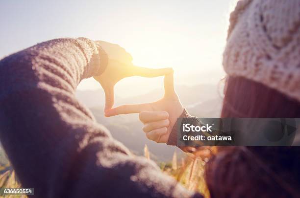 Woman Hands Making Frame Gesture With Sunrise Stock Photo - Download Image Now - Focus - Concept, Futuristic, Forecasting