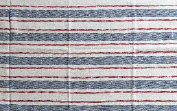istock Striped white kitchen towel with blue and red Texture 636651248