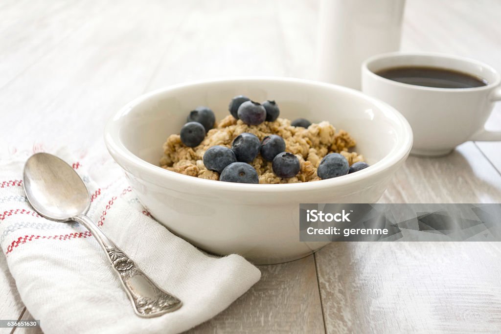 Oatmeal With coffee Table setting for breakfast. Blueberry Stock Photo