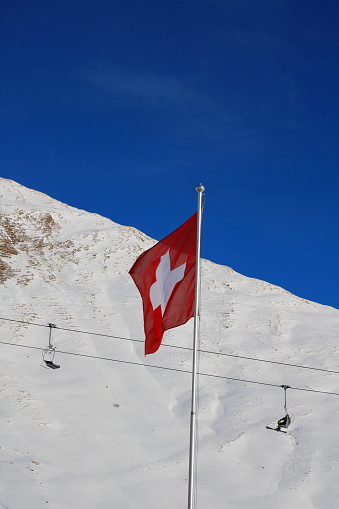 On the top of Switzerland in the Alps you find the Swiss flag in the Samnaun Ski mountains.