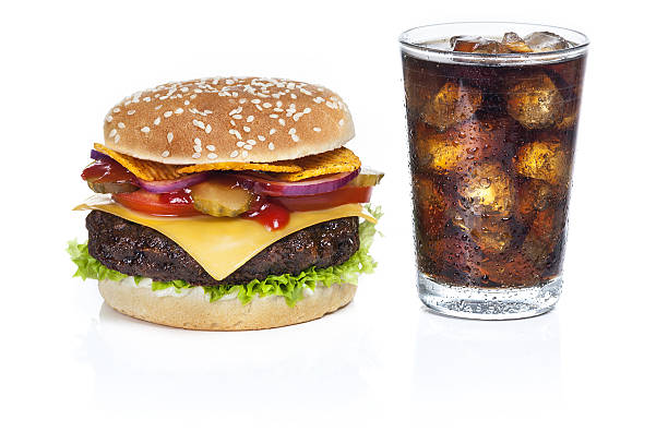 istock Beef burger with cheedar cheese and cola - isolated 636653212