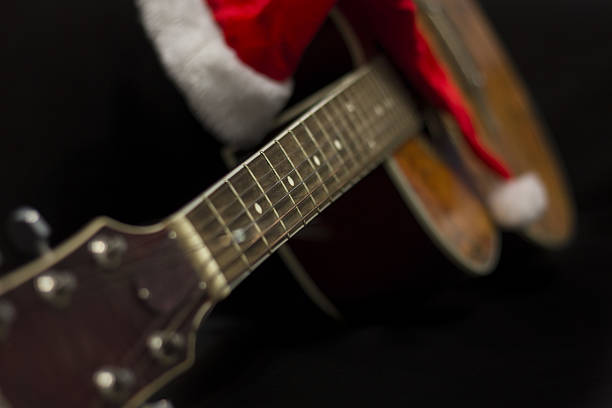 istock Acoustic guitar with Santa's cone 636660338