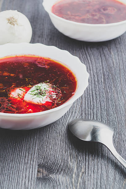 istock Beetroot soup on a dark wooden background 636660566