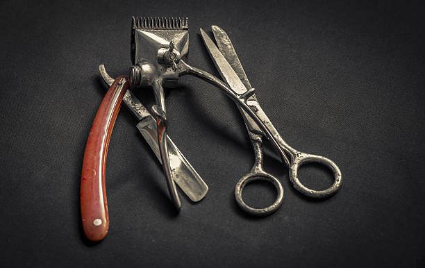 istock Vintage barber supplies on dark background 636661324