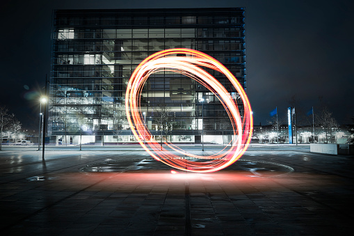 Light painting - circles drawn with lights in the big city at night