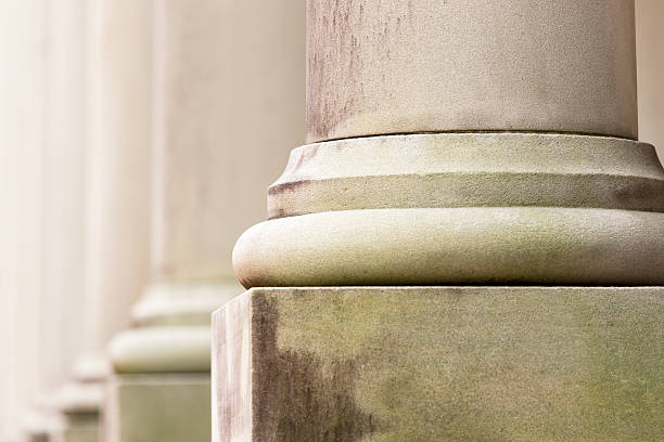 istock Closeup row of capital columns, background with copy space 636664168