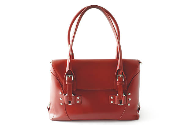 istock Red glossy female leather bag isolated on white background 636664480