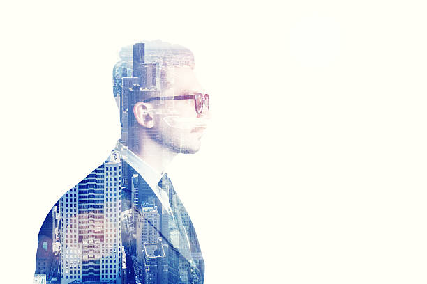 istock Businessman with glasses side view and blue city 636665374