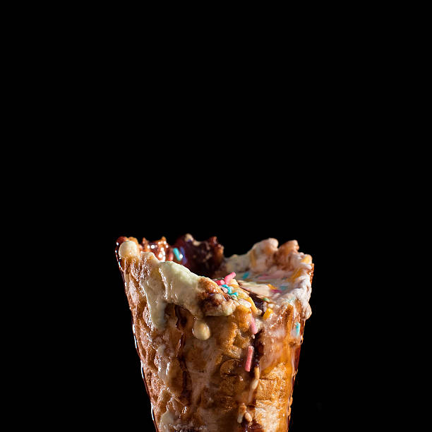 Melting Ice-Cream Cone on Black Background