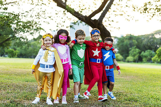 istock Superheroes Cheerful Kids Expressing Positivity Concept 636669378