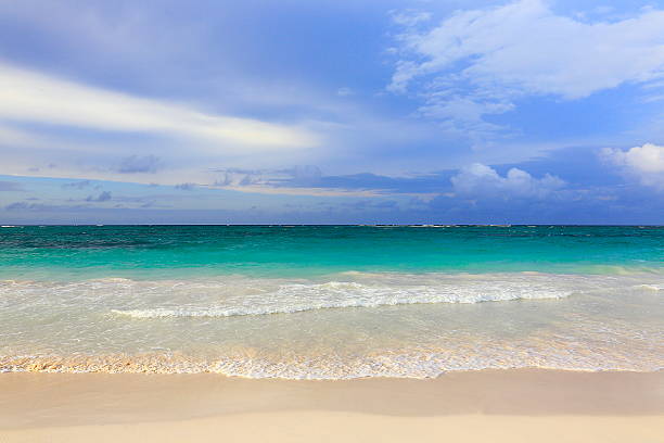 istock Idyllic sand beach, caribbean waves, dramatic sunrise, Cancun, Mexico 636669408