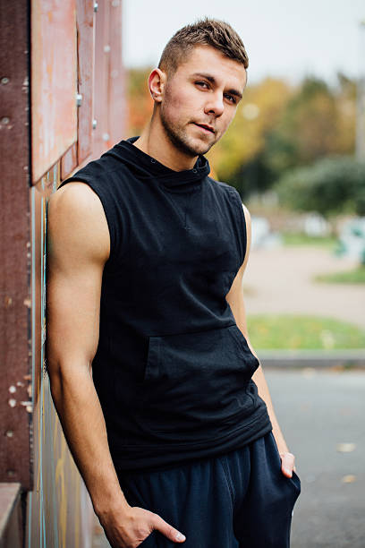 istock Portrait of a strong handsome man in training cloth. Posing 636670526