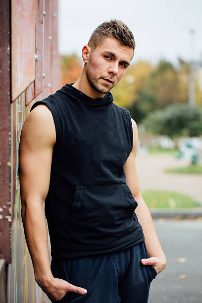 istock Portrait of a strong handsome man in training cloth. Posing 636670676