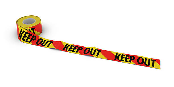 istock Red and Yellow Striped KEEP OUT Tape Roll unrolled 636670884