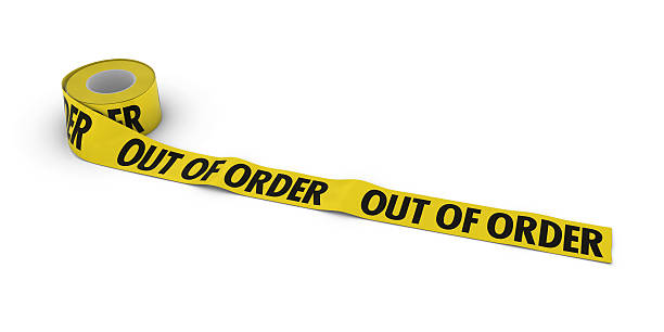 istock OUT OF ORDER Tape Roll unrolled across white floor 636670894