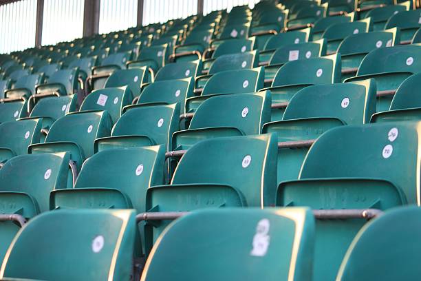 empty green grandstand seating in a regular symmetrical pattern empty green grandstand seating in a regular symmetrical pattern silverstone stock pictures, royalty-free photos & images