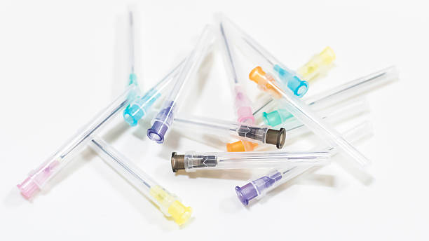 istock Colorful Needles put in needle sheath on white background. 636676912