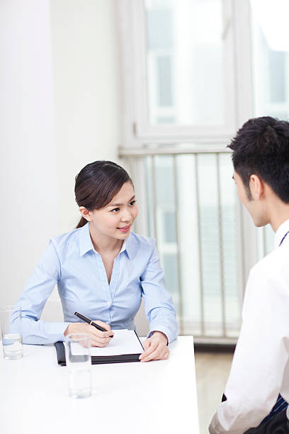 istock Group of businesspeople discussing in office 636679840