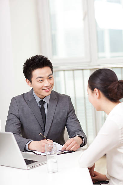 istock Group of businesspeople discussing in office 636680006