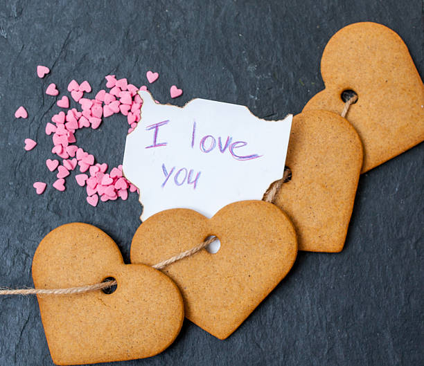 istock Cookies in the shape of a heart, candy and note 636680612