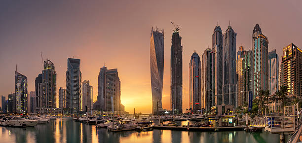 istock Dubai Marina Towers with glowing sunset 636681948