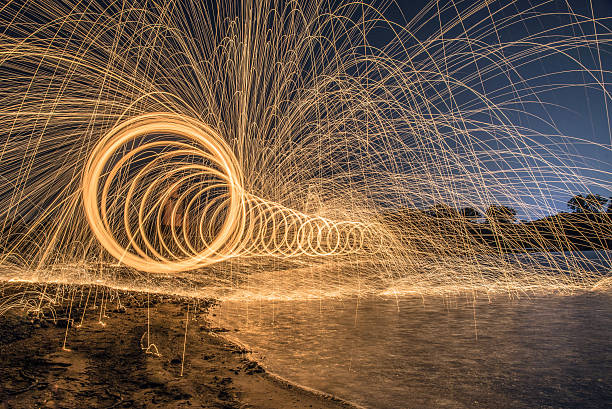 istock The work of glowing sparks from spinning steel. 636682146