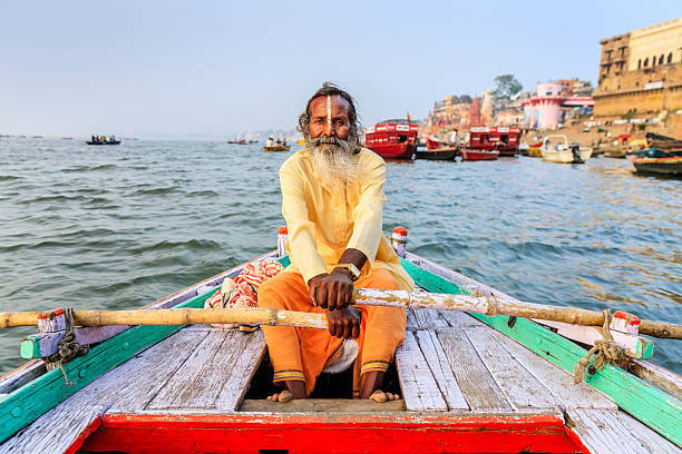istock Sadhu rowing boat on the holy Ganges River in Varanasi 636687208