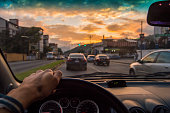 Driving at sunset. View from the driver angle,car focusinside