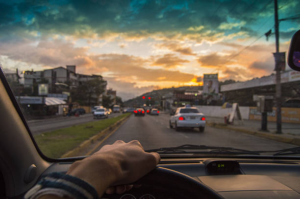 istock Driving at sunset. View from the driver angle,car closeup 636691182