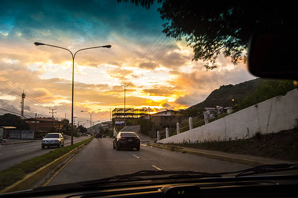 Driving at sunset. View from the driver angle while