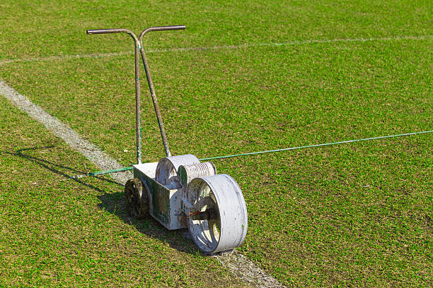 istock football, or soccer, field paint roller tool 636694290