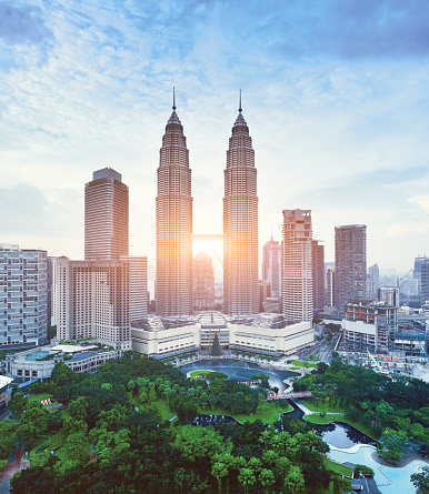 Kuala Lumpur urban scene and Petronas Towers at sunset, Malaysia.