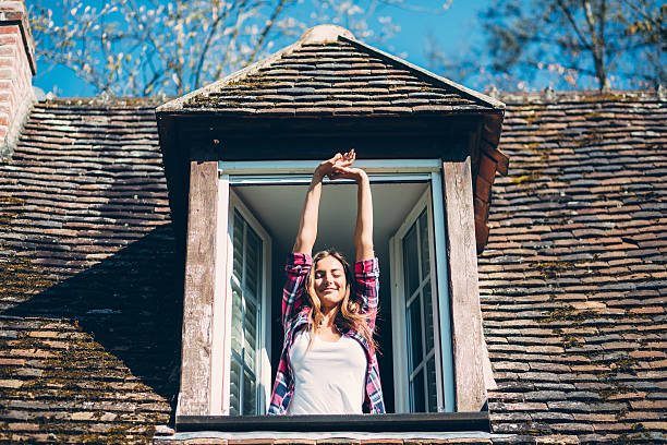 istock Young woman waking up 636695500