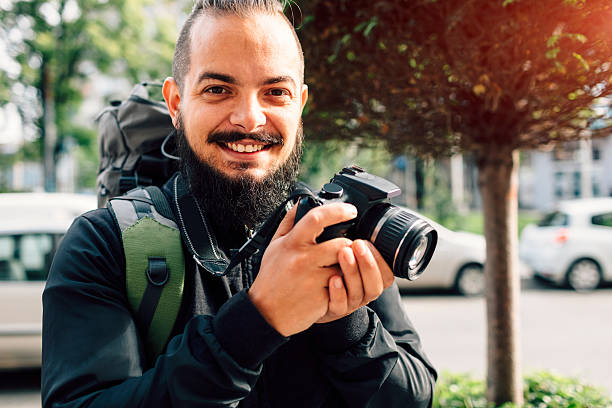 istock Bearded Backpacker In The City Photographing. 636695966