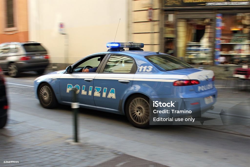 Alfa Romeo 159 police car in motion Turin, Italy - September 22th, 2011: Alfa Romeo 159 police car in motion on the street. This vehicle is used to patrols on the streets. Italy Stock Photo