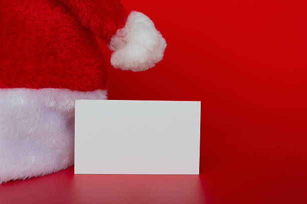istock Santa Claus hat with a blank card 636700154