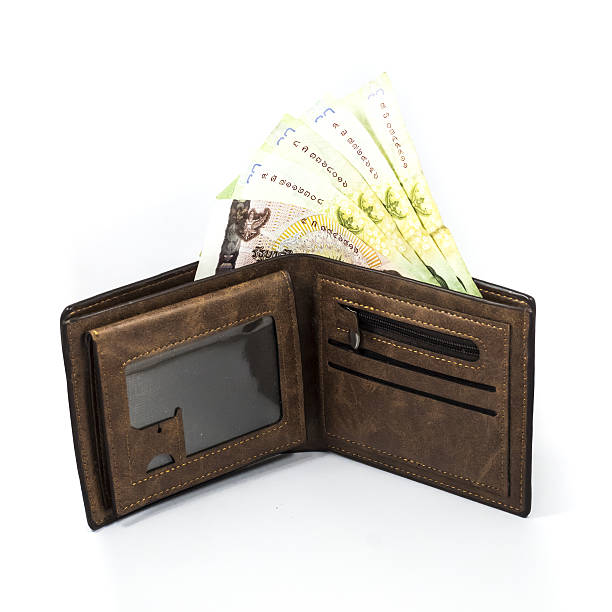 istock Bath bill in the brown wallet on white background. 636704120