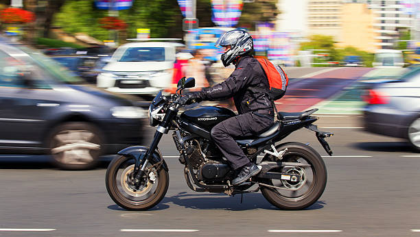 a motorcyclist is riding a bike