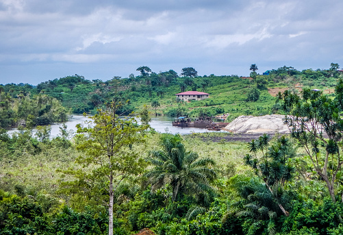 River and jungle. Natural rural landscape in Liberia. The beginning of the rainy season