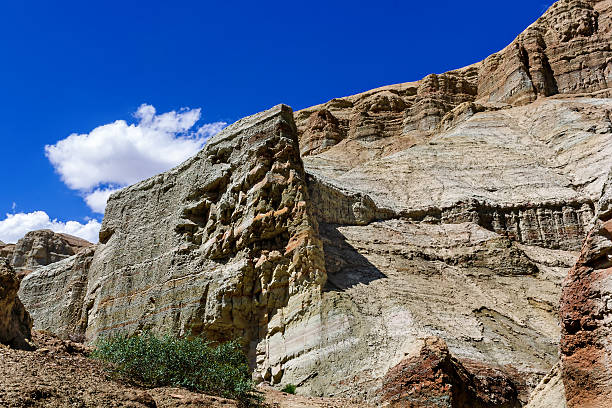 istock colorful rocks on the background of blue sky with clouds 636710554