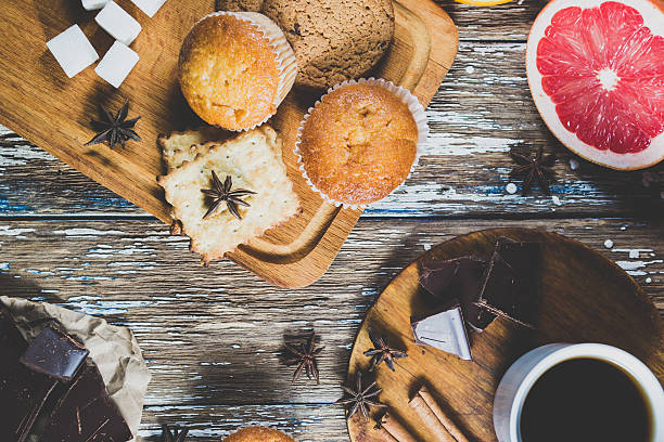 istock Sweets and citrus fruits on old wooden table 636711050