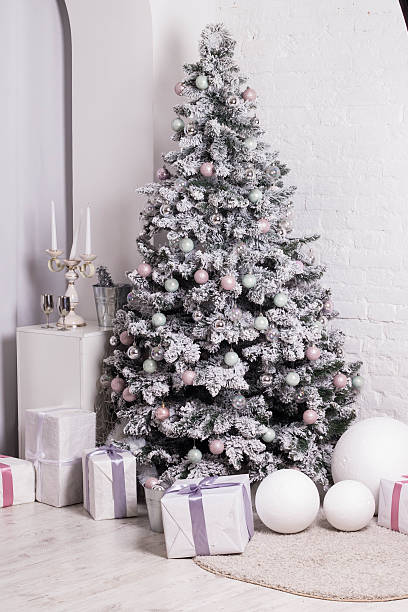 istock beautifully decorated Christmas tree with baubles, ribbons, snowflakes 636715100