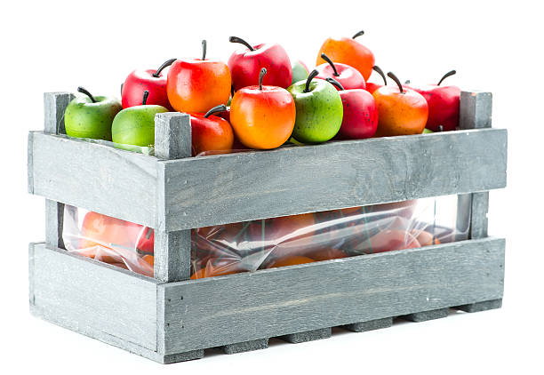 istock apple in wooden crate, isolated on white background 636715382