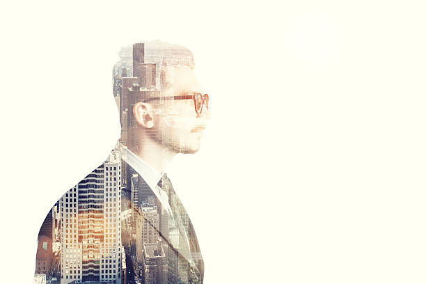 istock Businessman with glasses side view and brown city 636715656