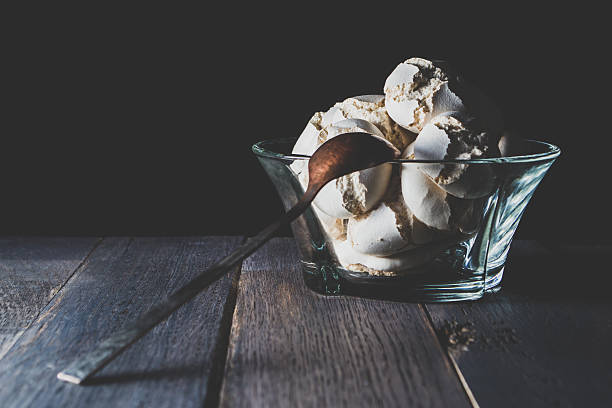 istock White meringue into the candy bowl on wooden table 636715662